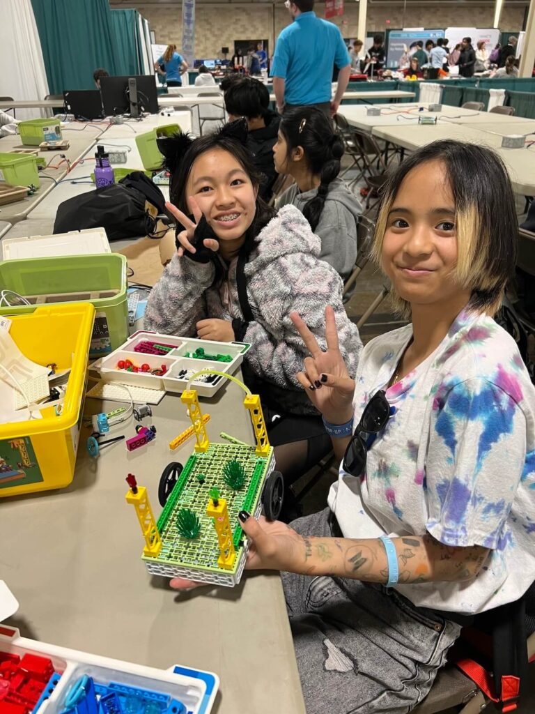 Two female students working on the micro:bit Tree Seeder project in the Climate Action Kit