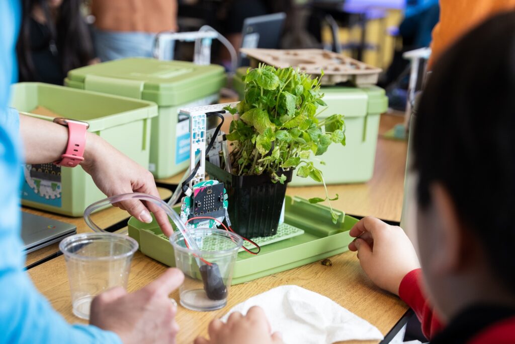 Students working on the micro:bit Smart Farming project from the Climate Action Kit