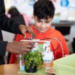 Student working on the micro:bit smart farming project from the Climate Action Kit