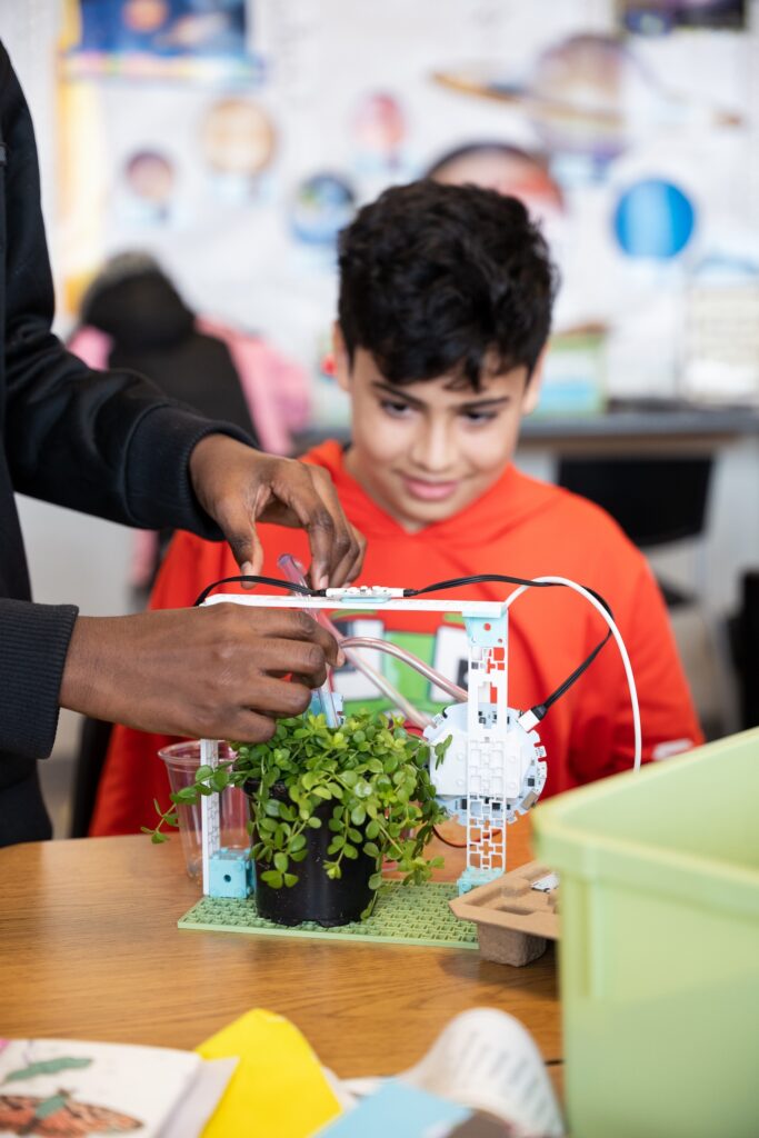 Student working on the micro:bit smart farming project from the Climate Action Kit