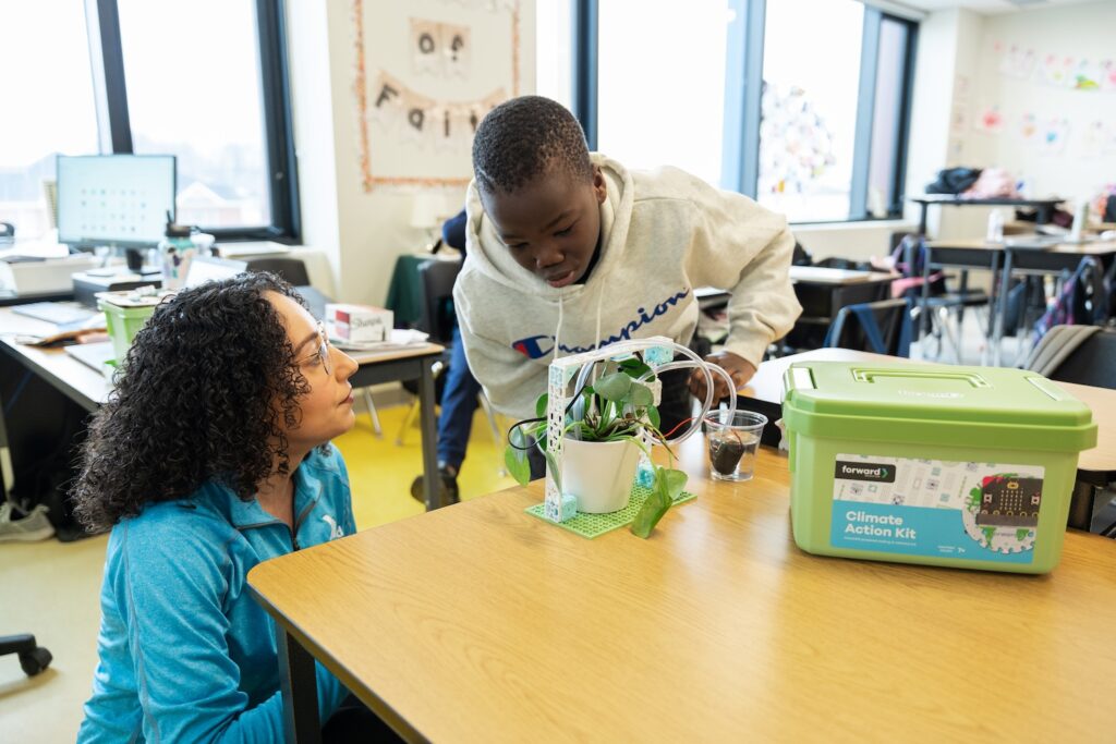Student and teacher working on the micro:bit Smart Farming project from the Climate Action Kit