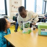 Student and teacher working on the micro:bit Smart Farming project from the Climate Action Kit