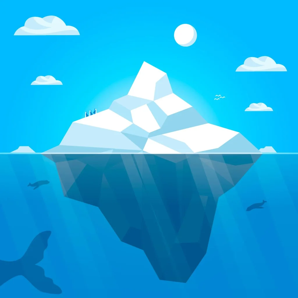 A large iceberg floating in the ocean, with a portion visible above the water and a larger section beneath, under a sunny sky with clouds.