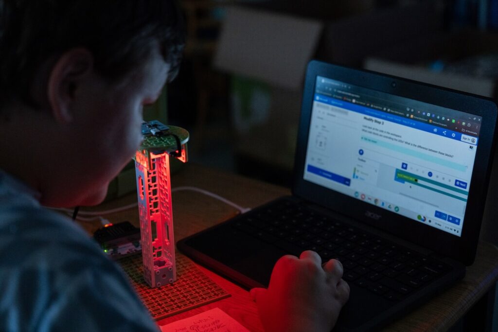 Turtle-Safe Beach Lighting project from the Climate Action Kit sitting on a desk with computer in the background