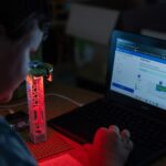 Turtle-Safe Beach Lighting project from the Climate Action Kit sitting on a desk with computer in the background