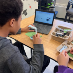 Student follows on-screen instructions to build the glacier satellite project.