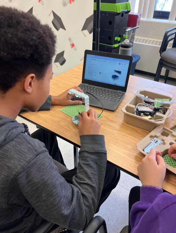 Student follows on-screen instructions to build the glacier satellite project.