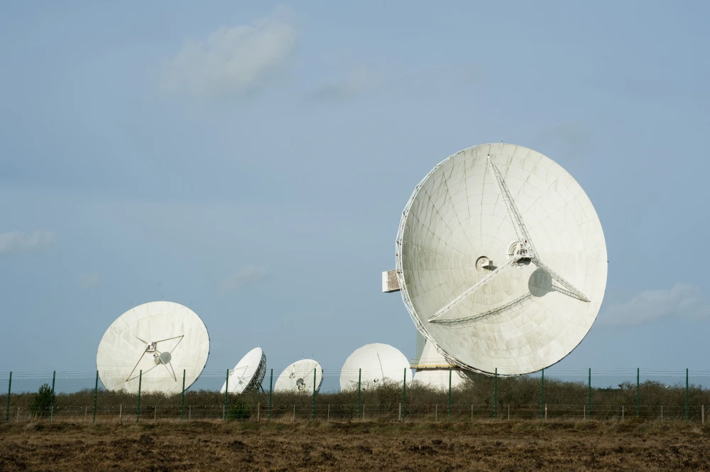 Five parabolic satellites are placed in field in various directions.