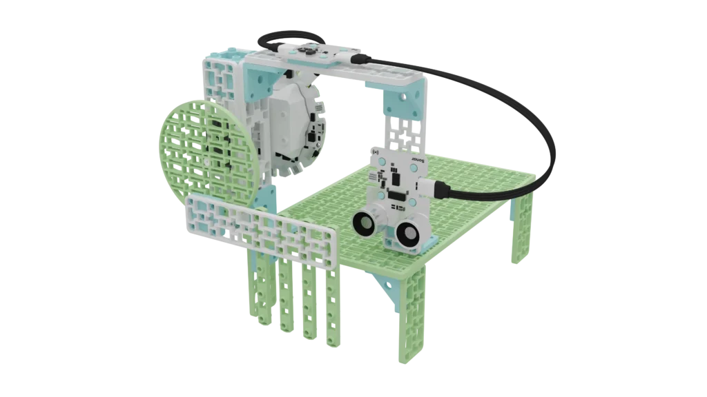 Animal crossing prototype build with the Climate Action Kit components. The base plate is elevated with the 4 short green frames to create a tunnel and an overpass. There is an entry to the bridge where the sonar sensor, solar sensor, and breakout board are attached. There is a gate to the tunnel that is attached to a positional servo motor.