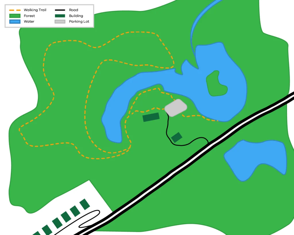 A map of a potential park that has a road cutting through the forested area, a large lake, a smaller lake below the road, some walking trails, and buildings.