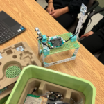 Completed build of the Hope Spot Station project sits on a student's desk among other pieces of the Climate Action Kit.