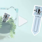 A highlighted moisture sensor in a project with a flower beside an enlarged moisture sensor with a large video play button in the centre.