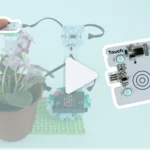 A highlighted touch sensor on a project with a flower beside an enlarged touch sensor with a large video play button in the centre.