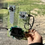 Forward Education's habitat monitoring project build indoors overlooking a grassy field