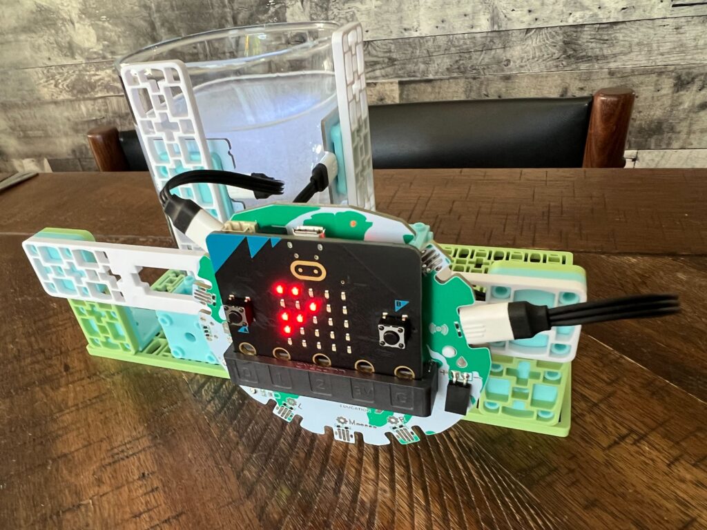 An NTU sensor setup with a cloudy glass of water positioned between the LED ring and the solar sensor.