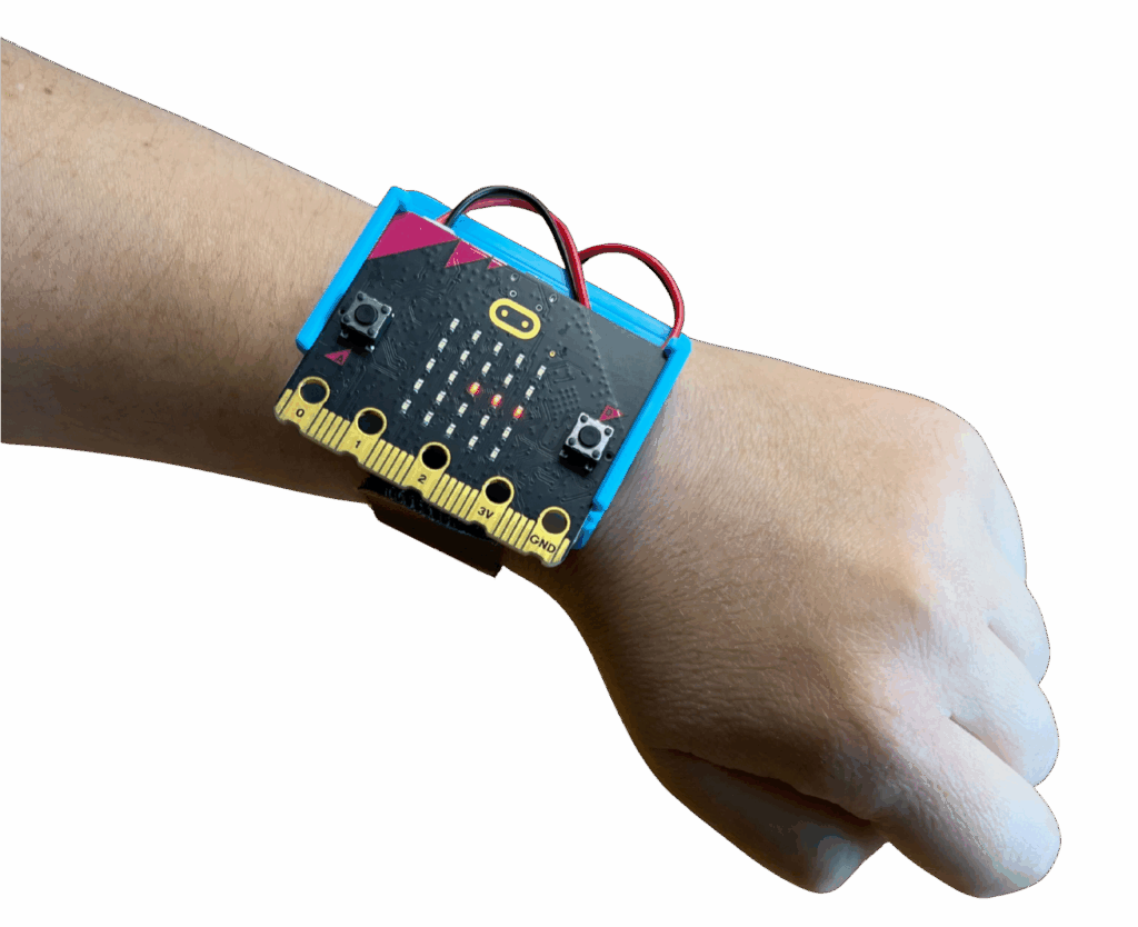 CHARGE for micro:bit strapped onto someone's wrist.